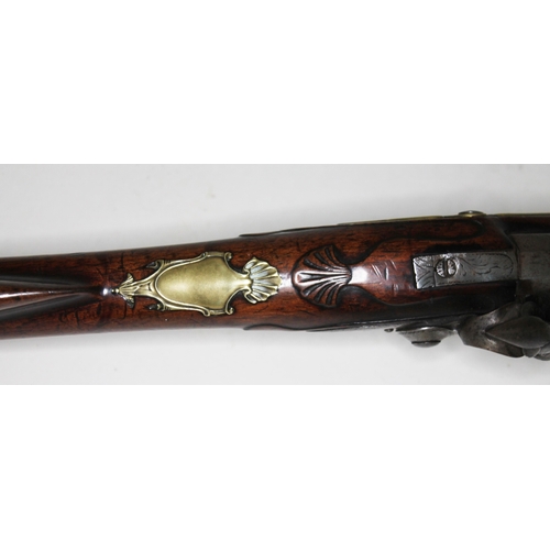 594 - A flintlock musket, circa 1800, 42cm octagonal barrel marked 'Rimes London', engraved plate also mar... 