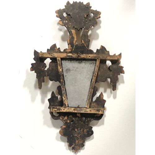 566 - A pair of carved gilt wood and gesso mirror, length 40cm each.