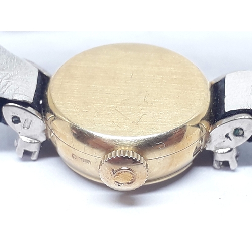 132A - A 1960s 18ct gold and diamond Omega ladies wristwatch with box and papers.