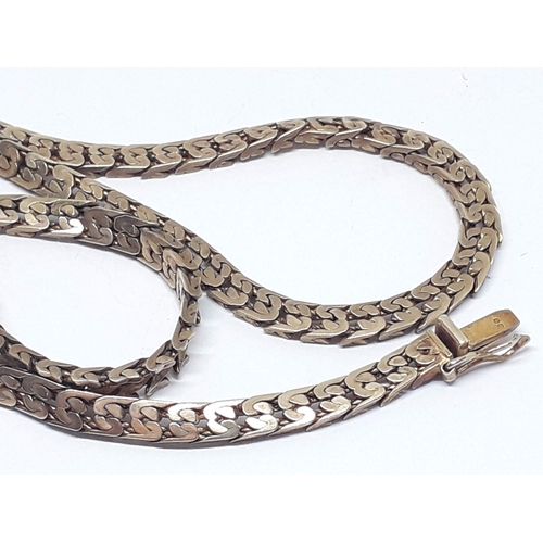 147 - A link necklace, length 44cm, 9ct gold import marks, weight 18.01g.