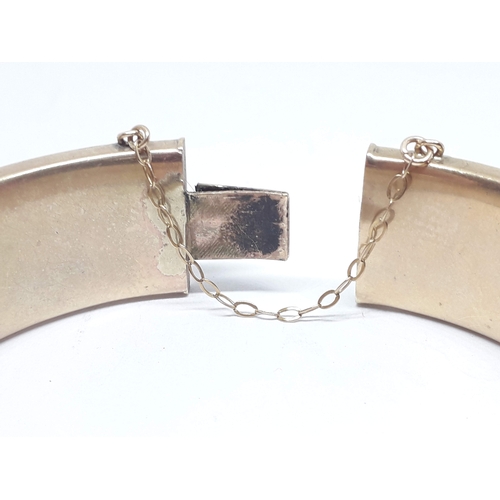 170 - A hallmarked 9ct gold bangle engraved with diamond design, sponsor's mark 'M, G&S', Chester 1935, di... 