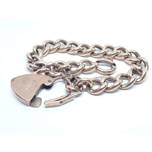 239 - A link bracelet, the heart shaped lock hallmarked 9ct gold, the end link marked '9c', length 16cm, w... 