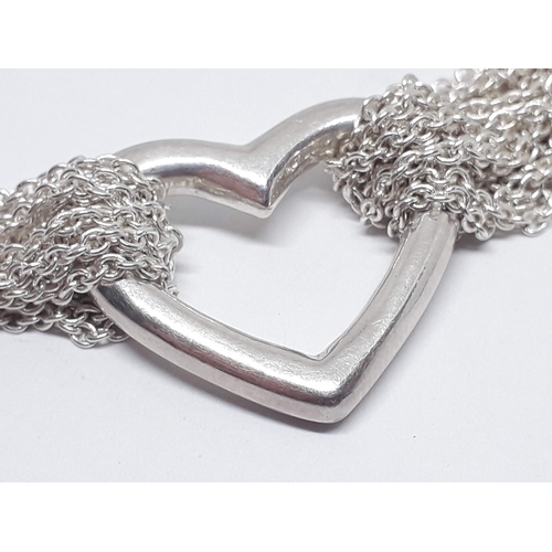 289 - A Tiffany & Co silver mesh chain toggle choker necklace with heart, length 38cm.