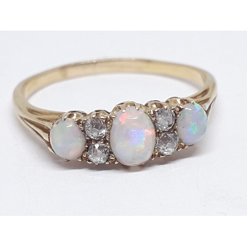 230 - An early 20th century precious opal and diamond ring, the central oval cabochon measuring approx. 5m... 