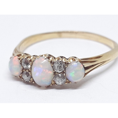 230 - An early 20th century precious opal and diamond ring, the central oval cabochon measuring approx. 5m... 