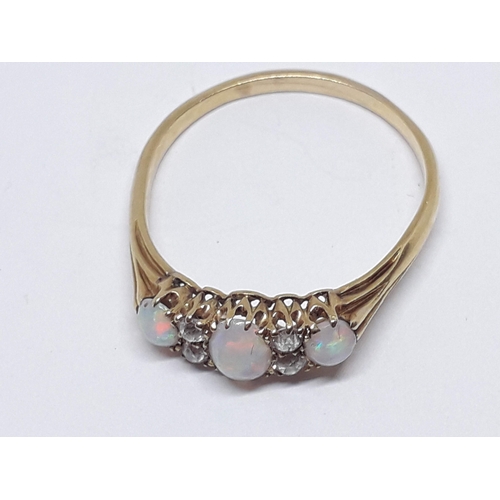 230 - An early 20th century precious opal and diamond ring, the central oval cabochon measuring approx. 5m... 