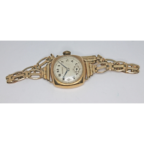 150 - A 1950s hallmarked 9ct gold Rotary 15 jewel manual wind ladies wristwatch on rolled gold strap, the ... 