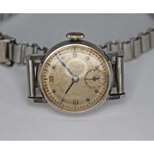 110 - A stainless steel IWC ladies manual wind wristwatch, circa 1942/43, the unsigned patinated dial havi... 