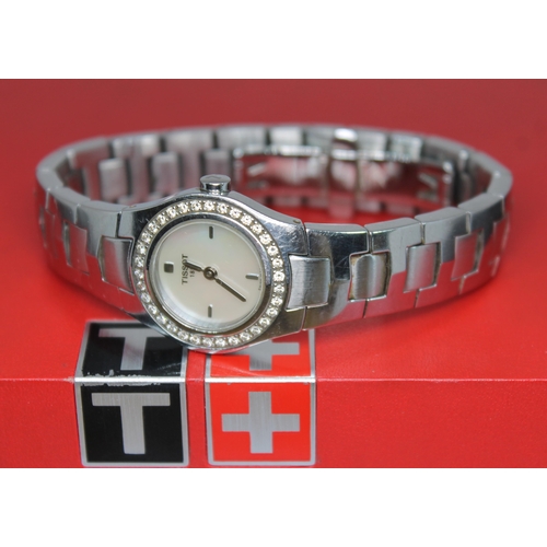 136 - A ladies stainless steel and diamond bezel Tissot L522 quartz wristwatch, with signed mother of pear... 