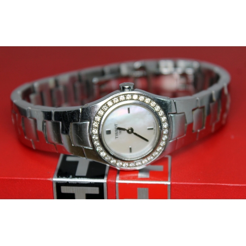 136 - A ladies stainless steel and diamond bezel Tissot L522 quartz wristwatch, with signed mother of pear... 