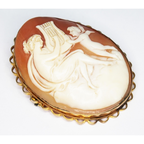 163 - A shell cameo brooch, length 52mm, indistinctly marked '9ct', gross wt. 18.06g.