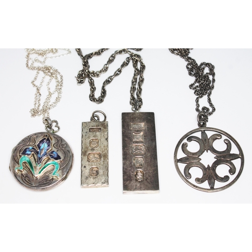 168 - A group of four hallmarked silver pendants comprising an ARt Nouveau style locket, two ingots and a ... 