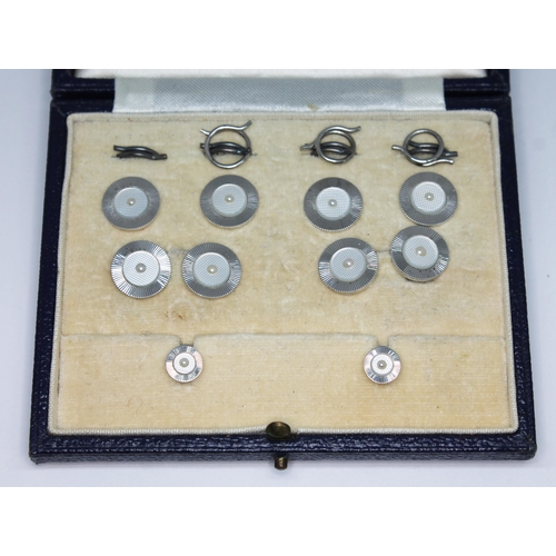 174 - An Art Deco mother of pearl and pearl cufflink and button set, maker's mark 'C&F' and also marked '9... 