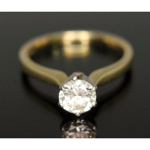 177 - A diamond solitaire ring, the modern round brilliant cut diamond weighing 0.69 carats, hallmarked 18... 