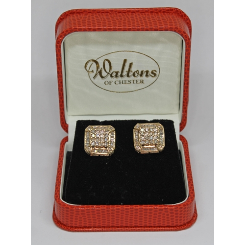 180 - A pair of Art Deco diamond cluster earrings, each stud set with 16 round brilliant cut diamonds to c... 