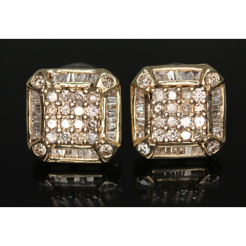 180 - A pair of Art Deco diamond cluster earrings, each stud set with 16 round brilliant cut diamonds to c... 