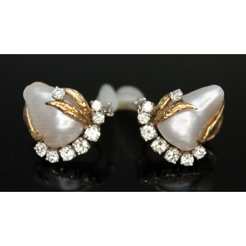 181 - A pair of diamond and pearl drop earrings, each naturalistically formed with a central baroque blist... 