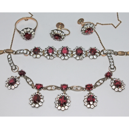 197 - A suite of garnet and white sapphire jewellery comprising a bracelet, necklace, ring and a pair of e... 