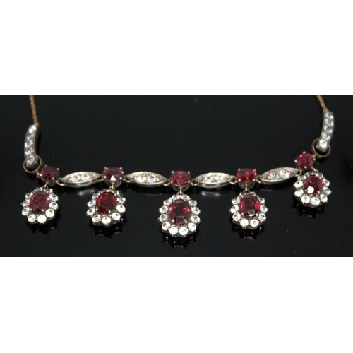 197 - A suite of garnet and white sapphire jewellery comprising a bracelet, necklace, ring and a pair of e... 