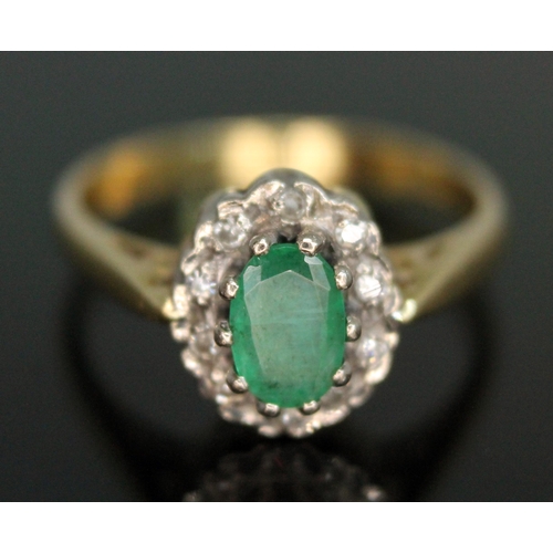 219 - An emerald and diamond cluster ring, the cluster measuring approx. 9.65mm x 8.05mm, hallmarked 18ct ... 