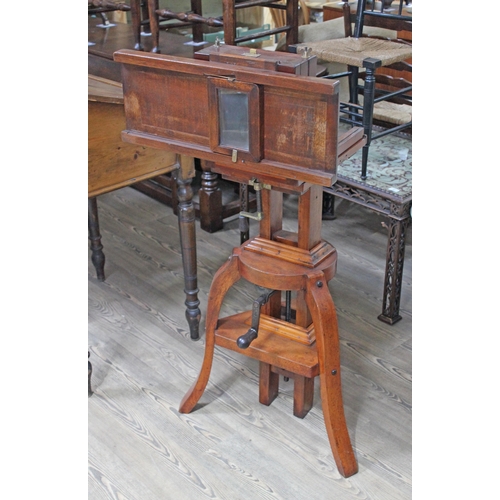 30 - A Victorian mahogany studio plate camera with Dallmeyer lens and on adjustable tripod base.