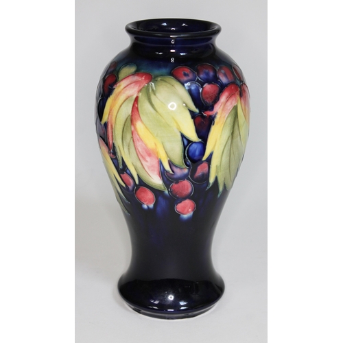 365 - A Moorcroft pottery vase, height 22.5cm, impressed and painted marks to base.