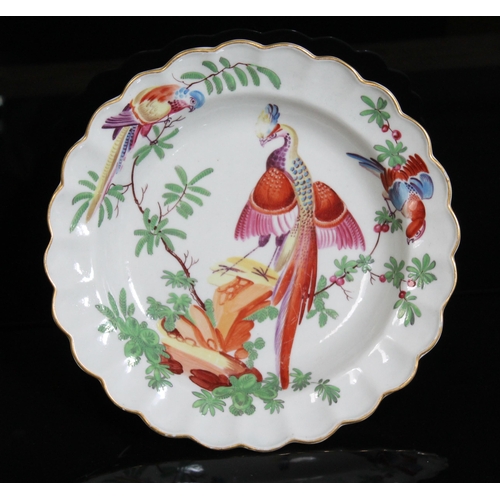 336 - A Worcester porcelain plate, circa 1770, of scalloped form and decorated in the workshop of James Gi... 