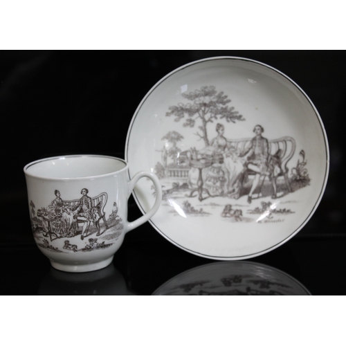 347 - A Worcester porcelain cup and saucer, circa 1765, black transfer design Tea Party, with Robert Hanco... 