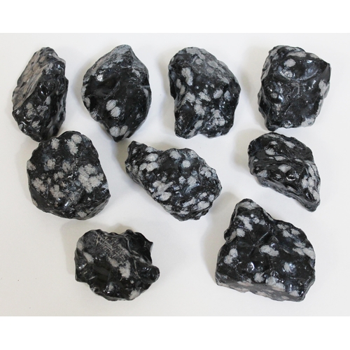 370 - Nine natural volcanic glass snowflake obsidian rough stones, ranging in length from 7cm to 9.5cm, to... 