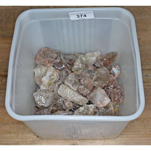 374 - A large quantity of rough rutilated quartz crystals, ranging in length from approx. 3cm to 8cm, tota... 