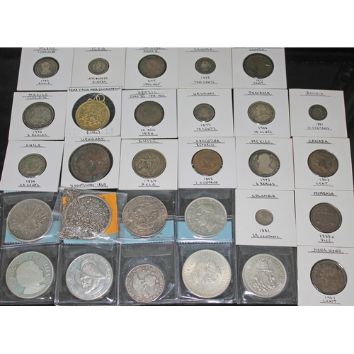 329 - A collection of world coins to include 1 x Hollandia wreck: Breales of Mexico 1743 silver chain, 1 x... 