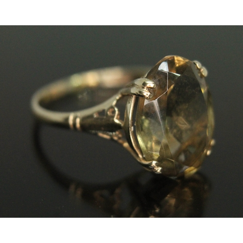 111 - A gold ring set with an oval cut citrine, gross wt. 2.46g, size M.