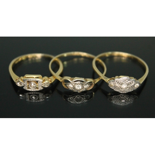 114 - A group of three three stone diamond rings, all marked '18ct', gross wt. 4.73g, size M/O.