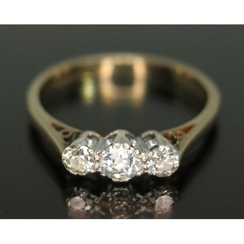 128 - A three stone diamond ring, three Old European cut diamonds weighing approx. 0.30 carats in total, h... 