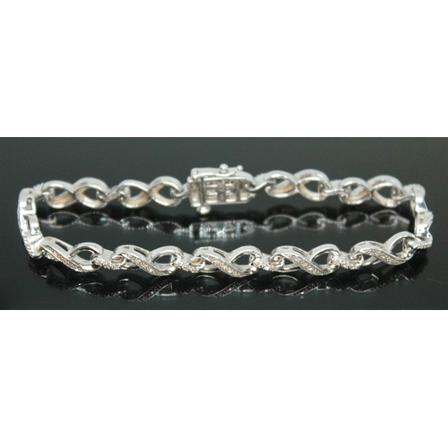 145 - A diamond bracelet, marked '925', length 18cm.