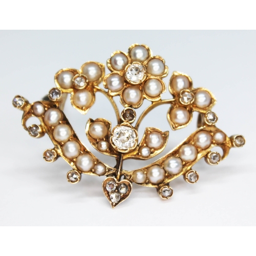 156 - A Victorian split pearl and diamond brooch of floral form, the central Old European cut diamond weig... 