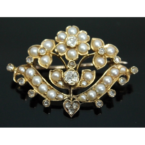 156 - A Victorian split pearl and diamond brooch of floral form, the central Old European cut diamond weig... 