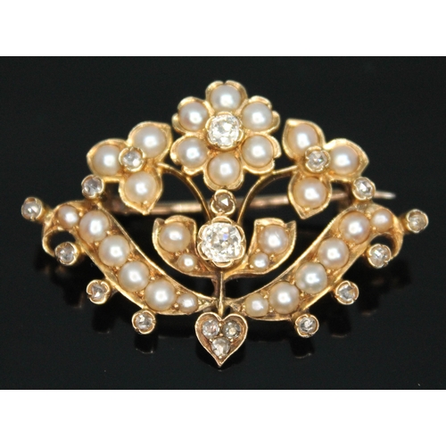 156 - A Victorian split pearl and diamond brooch of floral form, the central Old European cut diamond weig... 