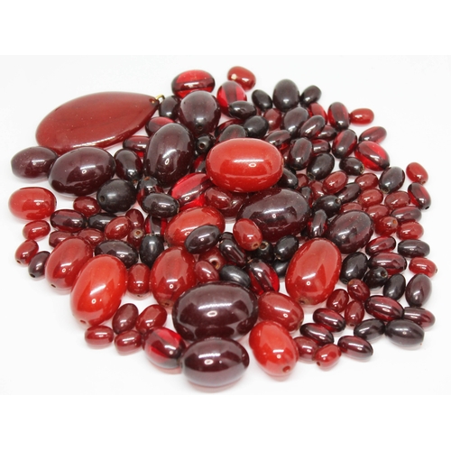 175 - Assorted graduated cherry bakelite beads, ranging in length from approx. 10mm to 32mm, together with... 