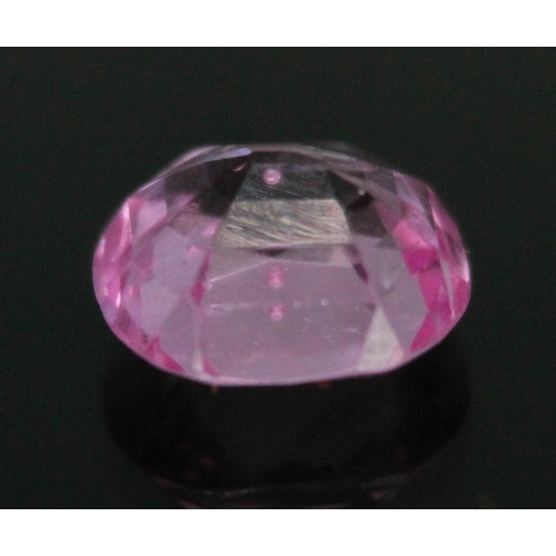 179 - A loose cushion cut fancy pink sapphire weighing 2.05 carats (0.41g).