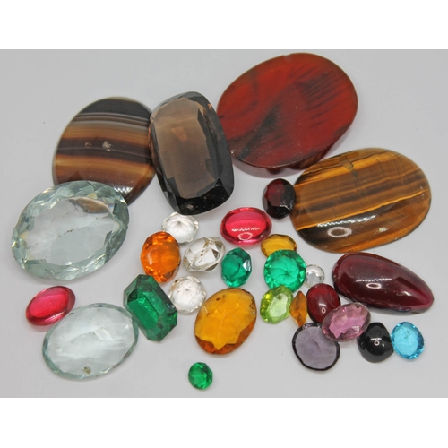 180 - A parcel of loose stones, mainly paste, also including quartz, garnet, agate etc.