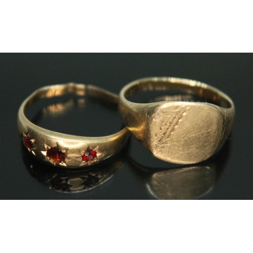 188 - Two 9ct gold rings, one set with red paste (split), gross wt. 6.36g.