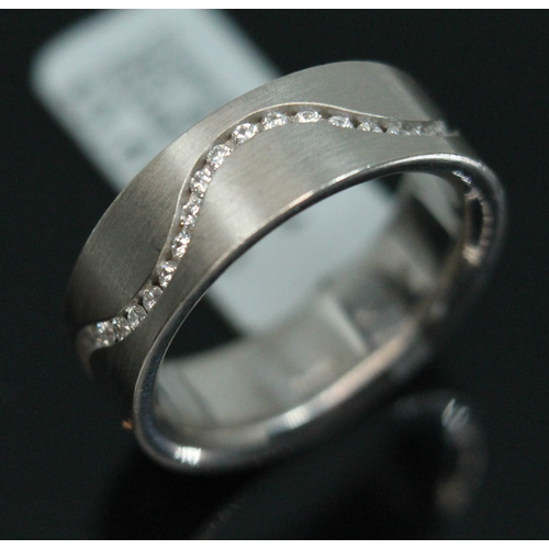 61 - A 18ct white gold diamond eternity ring by Niessing, total approx. diamond wt. 0.46 carats, inverted... 