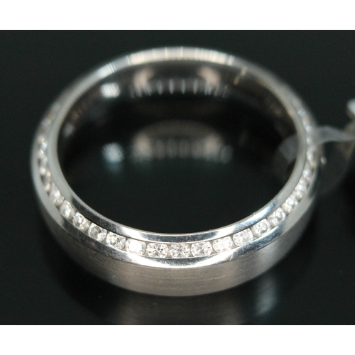 62 - A modern platinum and diamond wedding ring by Bunz, inverted D-section with polished interior and ou... 