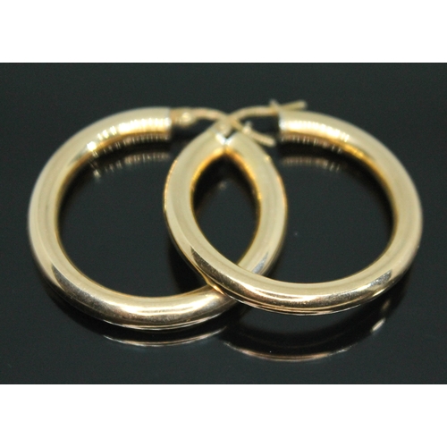 74 - A pair of Italian loop earrings, marked '375', wt. 3.74g.