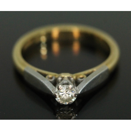 75 - A hallmarked 18ct gold diamond solitaire ring, the modern round brilliant cut stone weighing approx.... 