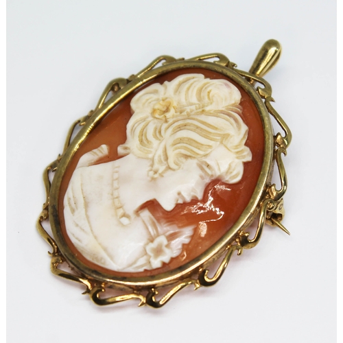 83 - A hallmarked 9ct gold mounted shell cameo pendant brooch, length 45mm, gross wt. 7.77g.