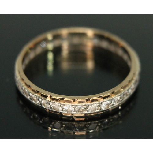 87 - An eternity ring set with colourless stones, marked '9ct', gross wt. 2.11g, size P/Q.