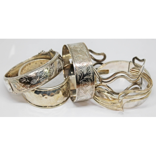 98 - Three hallmarked silver bangles and three others marked '925'.