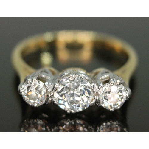 52 - A three stone diamond ring, the Old European cut diamonds weighing approx. 0.30, 0.72 & 0.33 carats,... 